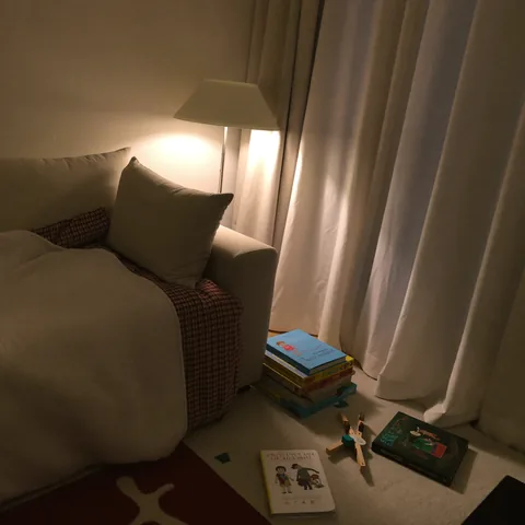 Cozy living room in the evening with a soft lamp